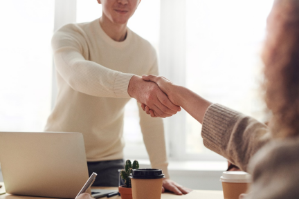 Candidate and interviewer shaking hands.