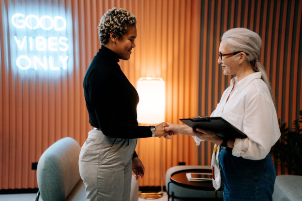 A renewable energy recruiter greeting a candidate