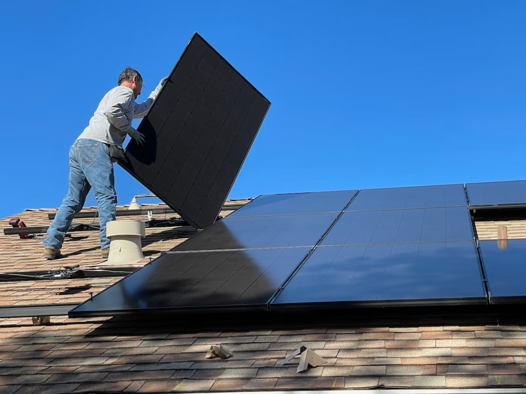  A person installing solar panels