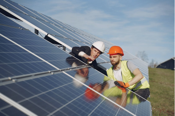 technicians-inspecting-solar-panels