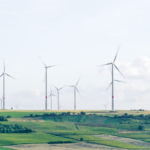 An image of wind turbines in a field
