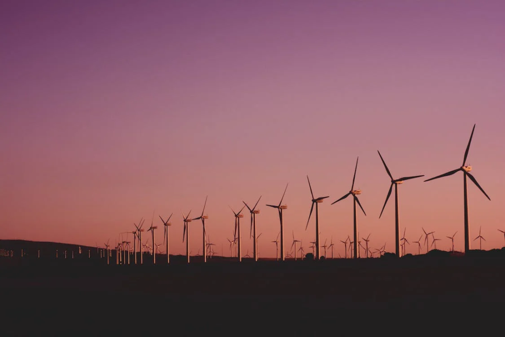 An image of a field with wind turbines