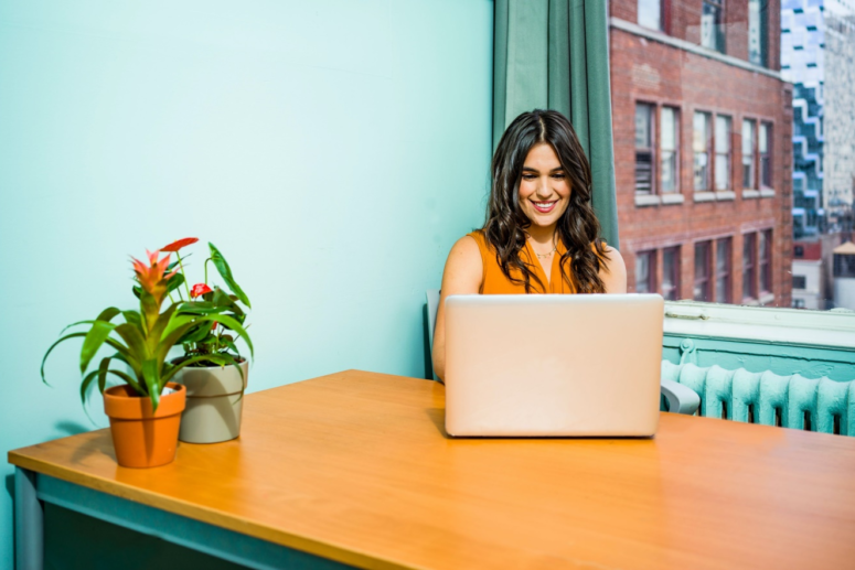 Woman using laptop in an office