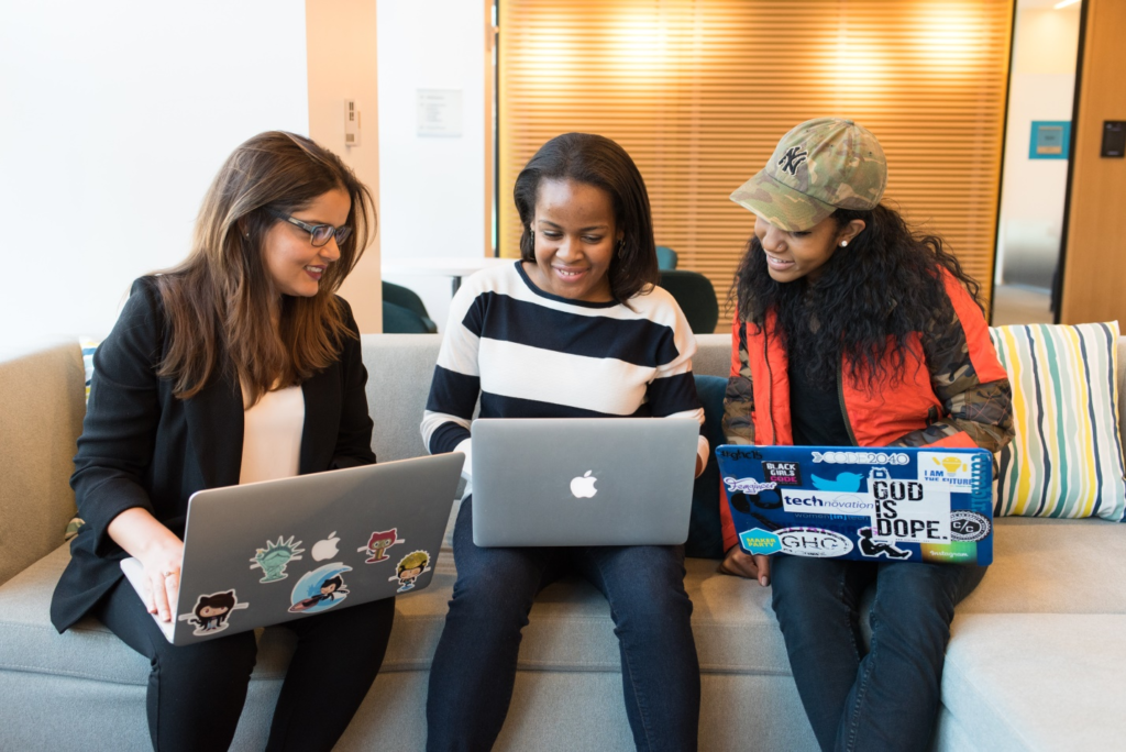 Three women using laptops